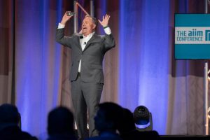 John Mancini giving his keynote at AIIM17 with his usual boisterous, manner